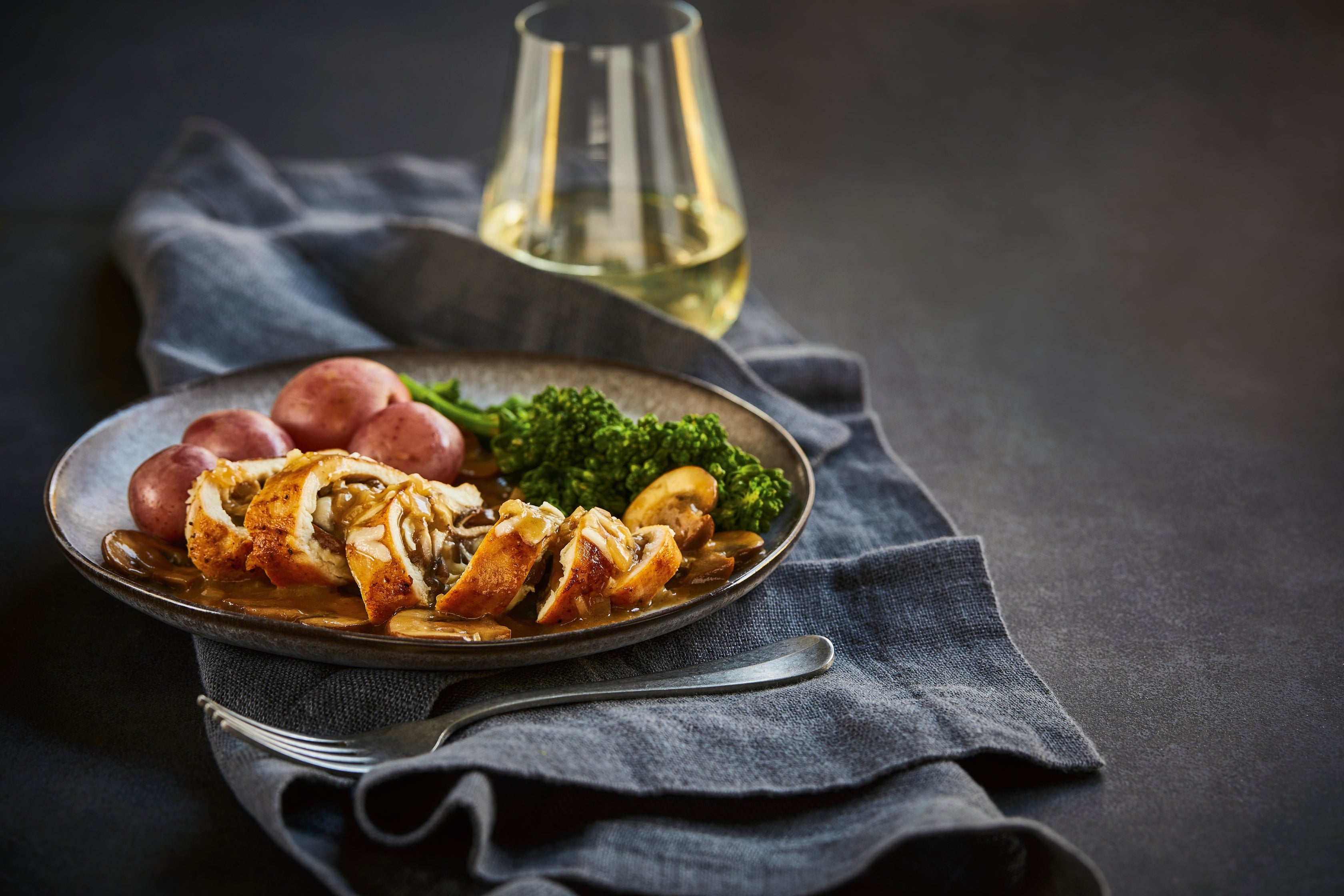 Mushroom and Swiss-Stuffed Chicken with Wine Sauce